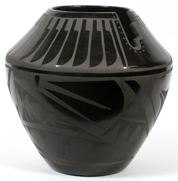 SAN ILDEFONSO VASE CARLOS SUNRISE DUNLAP: SAN ILDEFONSO BLACK ON BLACK VASE, CARLOS SUNRISE DUNLAP, H 11" W 10":Baluster form vase, with a stepped cut out form at rim; decorated in feathers about the shoulder, and stylized abstraction along t