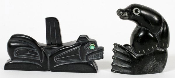 JACK POLLARD & OTHER INUIT STONE CARVINGS TWO: JACK POLLARD (HAIDA) & OTHER INUIT STONE CARVINGS, TWO, H 2 3/4", L 3 3/4":Including 1 Sea Wolf by Jack Pollard, carved argillite with inset abalone eyes, Haida, H.2", and 1 seal, unidentified signatu
