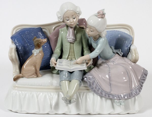 LLADRO PORCELAIN FIGURE GROUP 'STORY TIME', H 7 1/2": LLADRO PORCELAIN FIGURE GROUP, 'STORY TIME', H 7 1/2", #5229:An 18th century style boy and girl seated on a settee with an open book and attentive dog; number 5229.