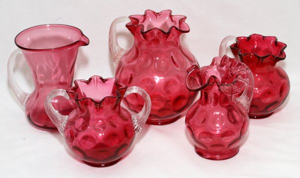 VICTORIAN CRANBERRY GLASS PITCHERS & SUGAR BOWL: VICTORIAN CRANBERRY GLASS PITCHERS & SUGAR BOWL, LATE 19TH C., FIVE PIECES, H 4 /2"-6 1/2":Including 4 pitchers and 1 sugar bowl; each has an applied clear glass handle.