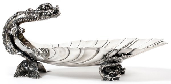 PAUL DE LAMERIE STERLING CENTERPIECE LONDON C. 1745: PAUL DE LAMERIE STERLING CENTERPIECE, LONDON, C. 1745, H 6", L 14 1/8":An oval footed centerpiece, comprised of a shell form bowl, fitted with a scrolled sea monster figural handle, and dolphin feet. 