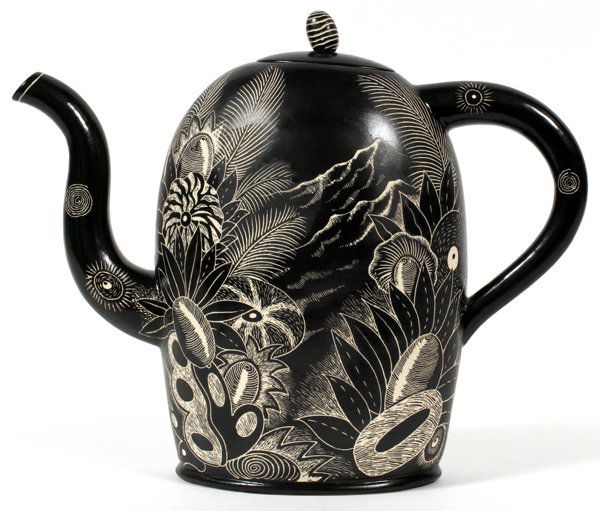 KURT WEISERART POTTERY TEAPOT: KURT WEISER (1950-), ART POTTERY TEAPOT, H 10 1/4", W 12":A black glazed pottery teapot, incise decorated in mountain landscape scene with foliage. Measuring H.10 1/4" x 12", signed at the lower rever