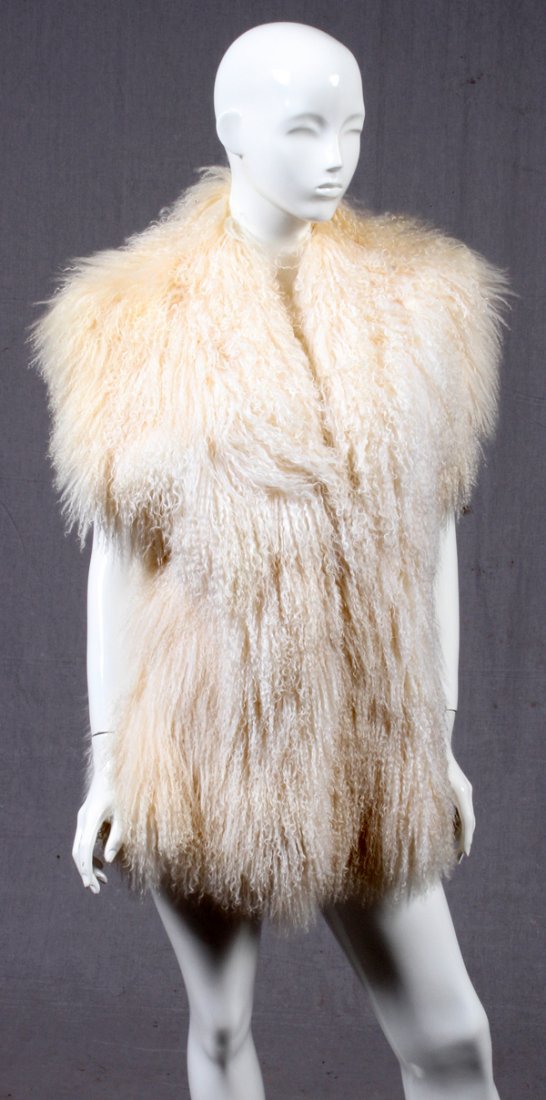 NEIMAN MARCUS LAMB FUR VEST: NEIMAN MARCUS LAMB FUR VEST, L 31":A lady's lamb fur vest. Labeled: Neiman Marcus, Made in Canada. Measuring L.31" x 20 1/2".