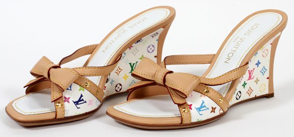 LOUIS VUITTON LEATHER WEDGE SANDALS PAIR: LOUIS VUITTON LEATHER WEDGE SANDALS, PAIR, SIZE 7 1/2:A pair of multi color monogrammed leather wedge sandals, with tan trim; labeled: Louis Vuitton, Paris. Size 37 1/2 European, 7 1/2 USA.