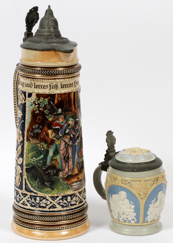 GERMAN MAGNUM & HALF LITER STEINS, TWO: GERMAN MAGNUM & HALF LITER STEINS, TWO, H 6" & 14 1/2':Including one 1/2 liter stein for Villeroy & Boch, panel decorated with figures in relief, at H. 6", stamped at the underside; together with one 