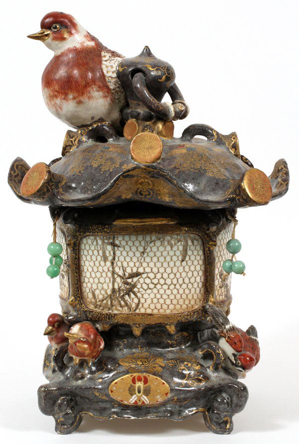 JAPANESE SATSUMA EARTHENWARE LANTERN: JAPANESE SATSUMA EARTHENWARE LANTERN, H 15" W 11":Surmounted by a bird figure, with small bird figures about the base; hung with beads, and decorated with gold detailing. The lantern measures H. 15 1/
