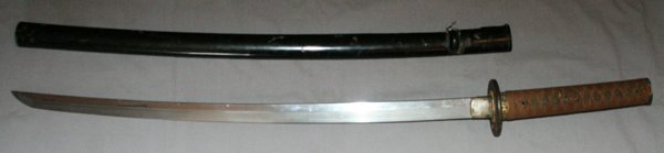 JAPANESE KATANA OFFICER'S SWORD C1940: JAPANESE KATANA, OFFICER'S SWORD, C1940, L 28" BLADE,:having a 25" blade (24" cutting edge), a silk wrap over ray skin hilt, missing Mekugi (bamboo pin), brass tsuba and decorations with gold accents.