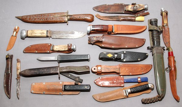 SHEATH KNIFE COLLECTION GERMAN/ AMERICAN 19 PCS: SHEATH KNIFE COLLECTION, GERMAN/ AMERICAN, 19 PCS:various hunting and sheath knives including: "Uncle Henry" Schrade, Antler handles, some with leather sheaths, U.S. fighting knife stacked leather han