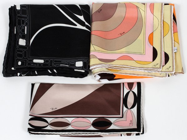 EMILIO PUCCI SILK SCARVES THREE: EMILIO PUCCI SILK SCARVES, THREE:Including 1 in shades of black, brown, and pink, 22" x 22"; 1 in shades of yellow, brown, and pink, 34" x 34"; and 1 black with white, 34" x 34". All are labeled "Emil