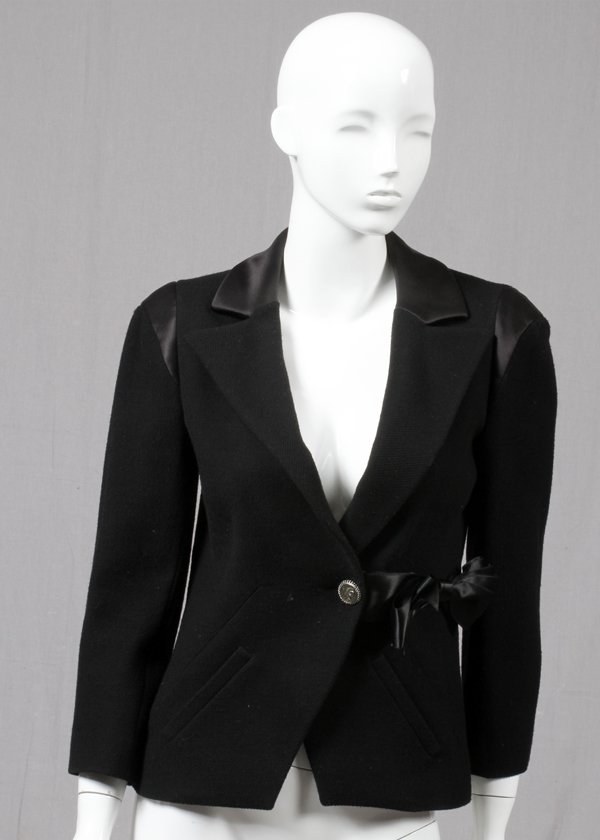 CHANEL BLACK WOOL BLEND & SILK BOW BLAZER: CHANEL BLACK WOOL BLEND & SILK BOW BLAZER, SIZE 42:Black wool blend blaze with black silk trim and bow accent, with single button closure. Size 42. Labeled: Chanel, Made in France, Autumn 2008 Collect