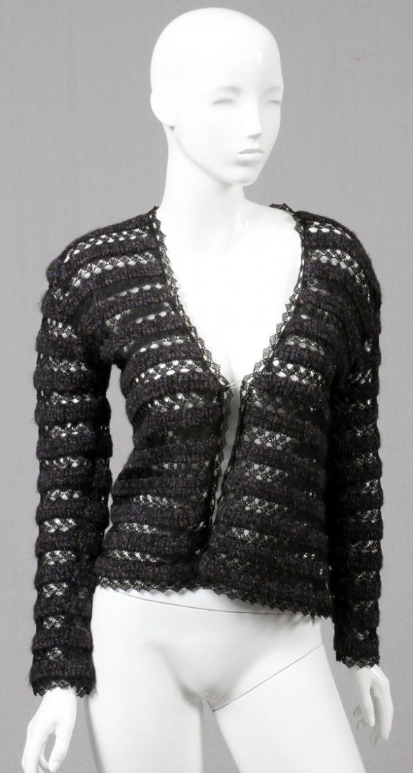 CHANEL SWEATER JACKET: CHANEL SWEATER JACKET:Alternating horizontal sweater and lace panels. Labeled: Chanel {tags have been cut}, approximate size 44. For a high resolution photo CLICK