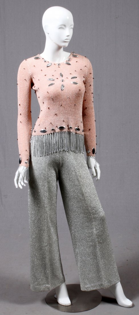 ADOLFO FOR SAKS FIFTH AVE. BEADED SWEATER & PANTS: ADOLFO FOR SAKS FIFTH AVE. BEADED METALLIC SWEATER TOP & PANTS, TWO:Pastel pink top, trimmed with metal fringe, together with a silvered pair of pants. Labeled: Adolfo at Saks Fifth Avenue. For a high