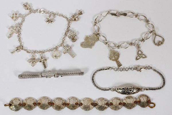 STERLING CHARM & LINK BRACELETS FIVE: STERLING CHARM & LINK BRACELETS, FIVE, L 7"-7 1/2":one having replica mercury dimes, two having cross motifs, one with leaf motif and one with charms having Celtic motif. 2.57 tr oz. total. For a high