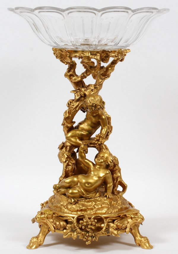 CHRISTOFLE FRENCH GILT BRONZE & CRYSTAL FIGURAL: CHRISTOFLE, FRENCH GILT BRONZE & CRYSTAL FIGURAL CENTERPIECE, C. 1880, H 19", W 13":A round crystal bowl with scalloped rim raised on a gilt bronze vine-like base with three putti sharing grapes and w