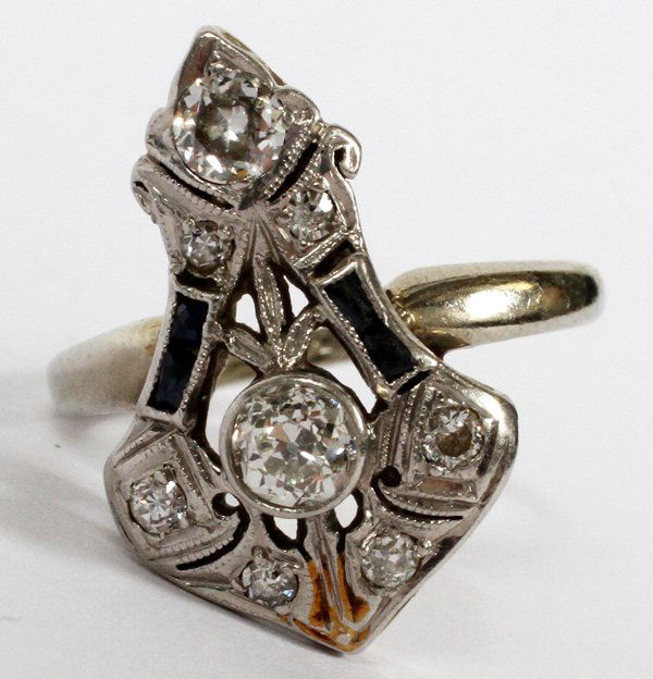 18KT WHITE GOLD DIAMOND & SAPPHIRE RING: 18KT WHITE GOLD, DIAMOND & SAPPHIRE RING:Containing 1 Old European cut diamond at .18ct; 1 Old European cut diamond at .12ct; 4 Old European cut diamonds at .08ct total; 4 emerald cut sapphires at .08