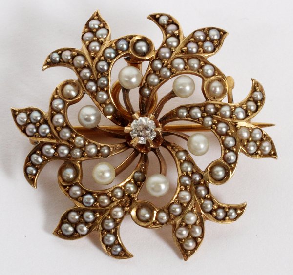 EDWARDIAN 14KT SEED PEARL/DIAMOND PENDANT/BROOCH: EDWARDIAN 14KT YELLOW GOLD, SEED PEARL & DIAMOND PENDANT/BROOCH, C. 1910, W 1":Circular, set with seed pearls and an enhancement diamond at the center, approximately .05ct., stamped "14K". Weighs appr