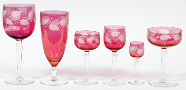 FLASHED CRANBERRY GLASS STEMWARE 23 PIECES: FLASHED CRANBERRY GLASS STEMWARE, 23 PIECES:Including 4 each of parfaits, white wines, red wines, cordials, and champagnes, H.4 1/4"-7", as well as 3 water goblets, H.7 3/4". For a high resolution pho