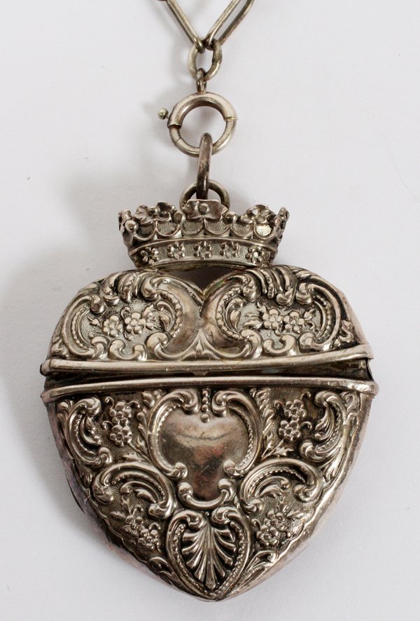 THEODORE W.FOSTER & BRO STERLING HEART PENDANT: THEODORE W. FOSTER & BRO. STERLING HINGED HEART-FORM PENDANT, EARLY 20TH C., L 2 1/4", WITH CHAIN:Including 1 sterling silver heart-form hinged pendant by Theodore W. Foster & Bro., L.2 1/4" (0.40 tro