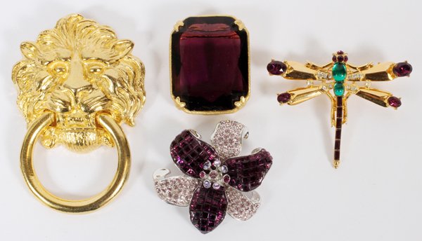 KENNETH LANE SWAROVSKI & OTHER COSTUME BROOCHES: KENNETH LANE, SWAROVSKI & OTHER COSTUME BROOCHES, FOUR, W 1 1/4"-2 1/2":Including 1 Kenneth Lane in the form of a lion's mask with ring, L.3 1/2", and 1 Swarovski in the form of a lily; together with 