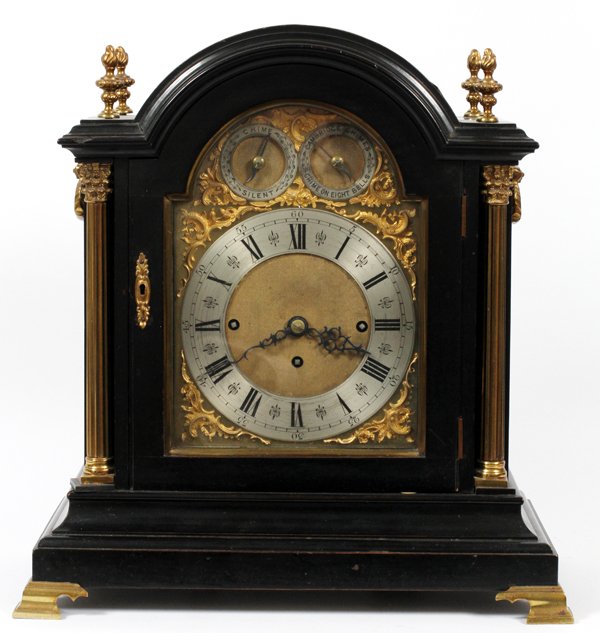 ENGLISH EBONY SHELF CLOCK 19TH C: ENGLISH EBONY SHELF CLOCK, 19TH C, H 18", W 15":Fitted in an ebony case, with metal dial, Cambridge chimes, and silent indicator. 19th Century. Three key wind movement. For a high resolution photo