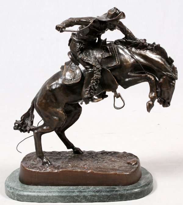 AFTER FREDERIC REMINGTON RECAST BRONZE SCULPTURE: AFTER FREDERIC REMINGTON, MODERN RECAST BRONZE SCULPTURE, LATE 20TH C., H 20", W 21", "WOOLY CHAPS":Signed; green marble bass. For a high resolution photo CLICK HE