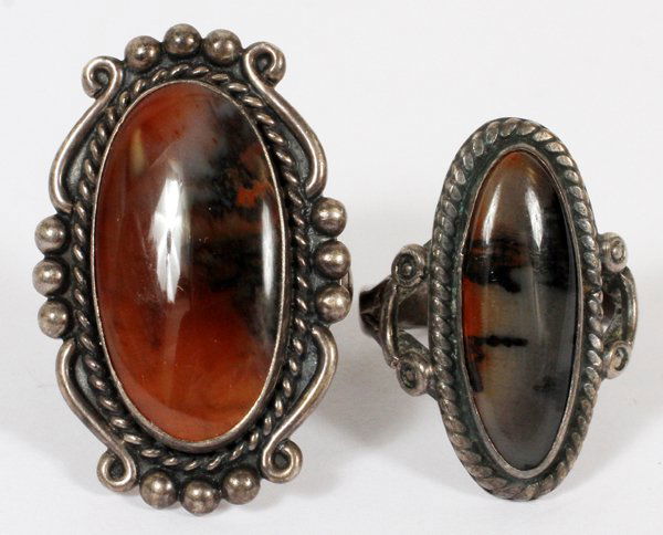 STERLING AND AGATE RINGS ELONGATED OVALS 2: STERLING AND AGATE RINGS ELONGATED OVALS, 2:Both having Sterling silver settings with multi-color agates in oval cabochon shapes. 0.56 tr oz total wt. sizes: 5 1/2 - 7. For a high resolution photo