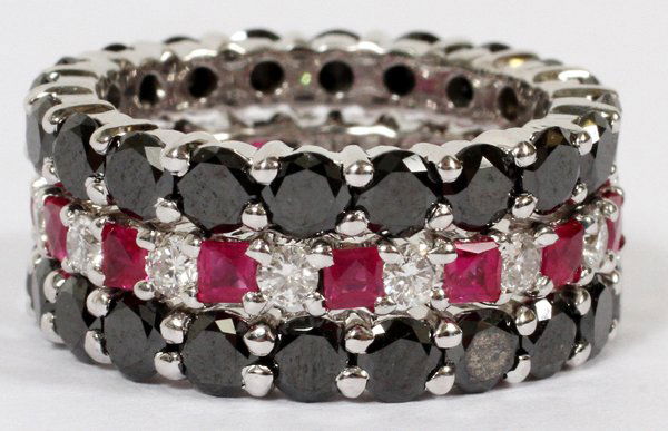 BLACK DIAMOND RUBY & DIAMOND STACKABLE RINGS: 4.00CT BLACK DIAMOND, .70CT RUBY & .50CT DIAMOND STACKABLE RINGS:G-color vs-2 clarity. 18kt. Gold. 7.6gms. Size 4. For a high resolution photo CLICK HERE