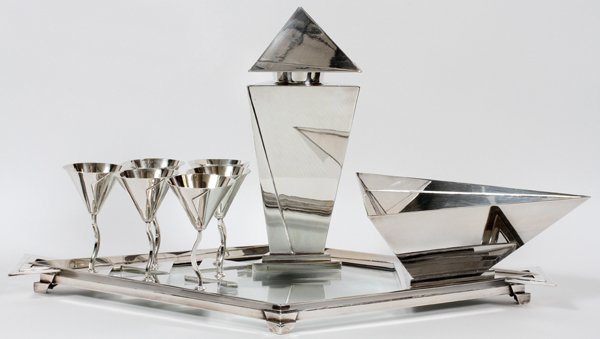 ELSA TENNHARDT/E & J BASS CO. COCKTAIL SET C. 1928: ELSA TENNHARDT/E. & J. BASS CO. SILVERPLATE COCKTAIL SET, C. 1928, NINE PIECES:Silver-plated brass set includes 1 decanter, H.12", 1 ice bowl, W.7", 6 cups, H.5", and 1 tray with glass center, L.23 1/