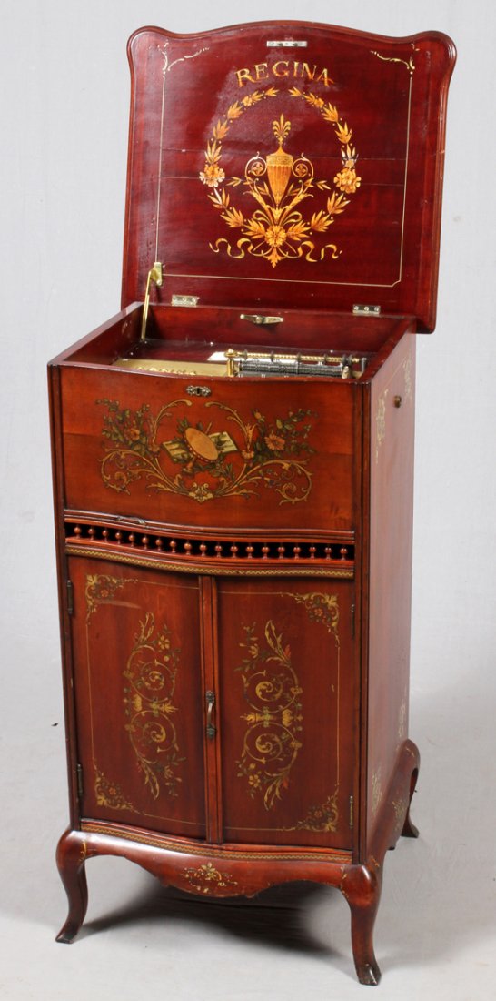 REGINA FLOOR MODEL DISC MUSIC BOX C1902: REGINA FLOOR MODEL DISC MUSIC BOX, C1902, H 40'', W 23'', D 20'':Regina floor model disc music box. Includes 15 Regina Music Box Co. metal discs. Serial # 58949. Last patent date May 20, 02.