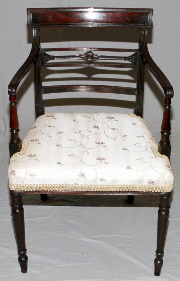 GEORGE III CUBAN MAHOGANY ARM CHAIR C1800: GEORGE III, CUBAN MAHOGANY, ARM CHAIR, C1800,:having horizontal back splats, fluted arm rests and turned and tapered armrest supports and front legs. Newer floral print on beige upholstery. C1800. For