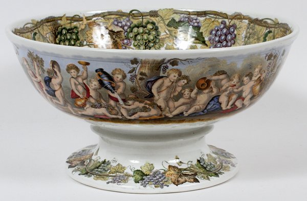 IRONSTONE POTTERY PUNCH BOWL C. 1880: IRONSTONE POTTERY PUNCH BOWL, C. 1880, H 8", DIA 14":"GILDEA" (Gildea and Walker) impressed. Having a stencil motif of cherubs harvesting grapes and drinking wine. Made in England. For a high resoluti