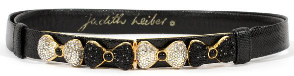JUDITH LEIBER BLACK KARUNG BELT W/ BOW BUCKLE: JUDITH LEIBER BLACK KARUNG BELT WITH BOW BUCKLE:Black karung snakeskin belt with gold tone crystal encrusted clasp. Four bows in alternating colors of clear and black crystals. Adjustable size. Labele