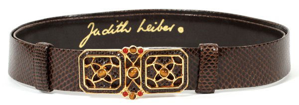 JUDITH LEIBER BROWN KARUNG BELT W/ JEWELED BUCKLE: JUDITH LEIBER BROWN KARUNG BELT WITH JEWELED BUCKLE:Brown karung snakeskin belt with gold tone and jeweled buckle set with red and brown stones. Adjustable size. Labeled: Judith Leiber. Belt clasp mea