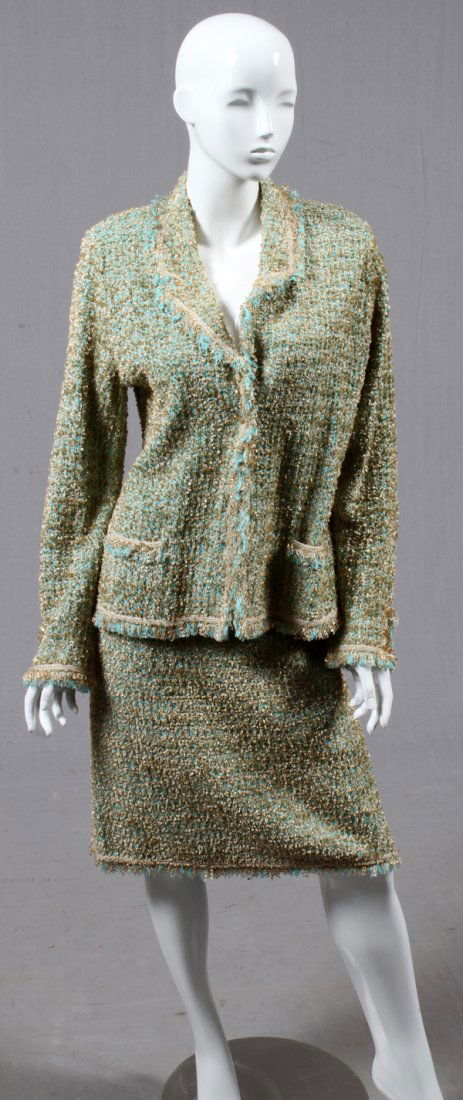 ESCADA TEAL & GOLD BOUCLE SKIRT SUIT: ESCADA TEAL & GOLD BOUCLE SKIRT SUIT, SIZE 44:Teal and gold jacket with button closure with two external open pockets. Labeled: Escada, Made in Germany. Size 44. Matching skirt with elastic waist. Lab