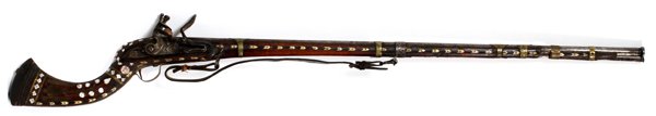ARABIAN RIFLE 19TH C.: ARABIAN RIFLE, 19TH C. L 40" BBL.:Having a flint-lock, mother-of-pearl, brass and bone inlays, shoulder strap, Brass barrel bands. Metal ram rod. Wood stock (as is) along barrel. Reverse curve shoulde