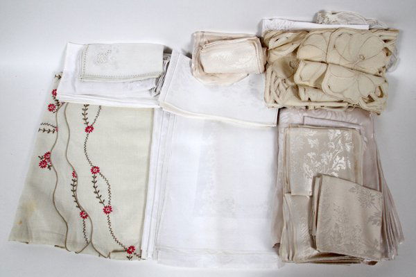 LINEN LACE TABLECLOTHS NAPKINS & TABLE RUNNERS: LINEN, LACE TABLECLOTHS, NAPKINS & TABLE RUNNERS 56 PCS.:includes five table cloths, 120" x 72 sculptured design, one round with scalloped edge, 70" Dia., one round with embroidered red flowers, 64" D