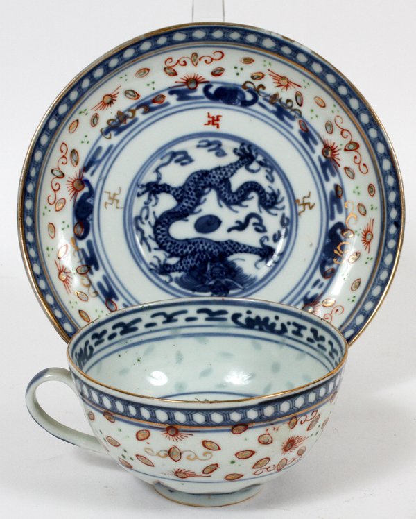 CHINESE PORCELAIN CUP & SAUCER: CHINESE PORCELAIN CUP & SAUCER, DRAGON MOTIF:Blue and white with iron red accents. "China" mark on the undersides. For a high resolution photo CLICK HERE
