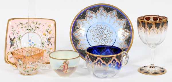 MOSER ENAMELED CUPS & SAUCERS C. 1900, SIX PIECES: MOSER ENAMELED CUPS & SAUCERS, C. 1900, SIX PIECES:Including 1 stemmed glass, H.4 1/4", 1 handled cup, and 1 saucer, signed, Dia.5 1/4"; each is trimmed in blue and fired gold, with enamel decoration 