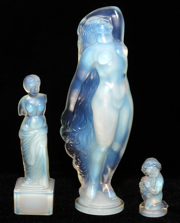 SABINO OPALESCENT GLASS FIGURES THREE: SABINO OPALESCENT GLASS FIGURES, THREE, H 1 3/4"-7":Including 1 standing nude with flowing hair, 1 classical nude female, and 1 putto. All are signed. For a high resolution photo