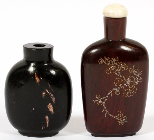 EBONY SNUFF BOTTLES, TWO: EBONY SNUFF BOTTLES, TWO, H 2" & 2 3/4":Including one with silver inlay and another with mica, without a stopper. For a high resolution photo CLICK HERE