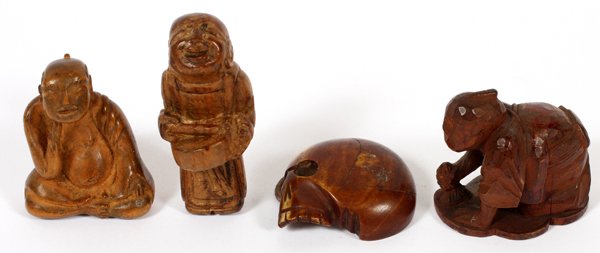 JAPANESE WOOD NETSUKES 19TH C. FOUR: JAPANESE WOOD NETSUKES, 19TH C., FOUR, H 1 1/2"-2":Including 1 bone skull, H.1 1/2", 1 standing man with drum, H.2", 1 Buddha, H.1 1/2", and 1 man with mallet, H.1 1/3". For a high resolution photo