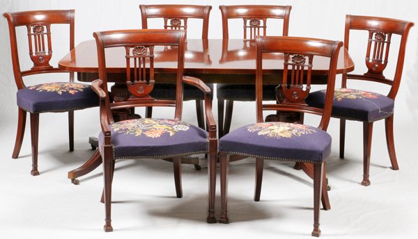 DUNCAN PHYFE STYLE MAHOGANY DINING SET: DUNCAN PHYFE STYLE MAHOGANY DINING SET:A two pedestal table H 28.5", L 64", D 32" with three leaves, each L 11". Accompanied by a six drawer, two door sideboard H43", L 57", D 22", and five side chair