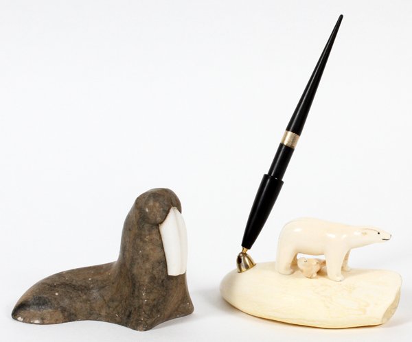 INUIT CARVED STONE AND SCRIMSHAW ANIMAL FIGURES TWO: INUIT CARVED STONE AND SCRIMSHAW ANIMAL FIGURES, TWO:Including a carved stone walrus and a scrimshaw pen holder featuring a polar bear and a seal. For a high resolution photo