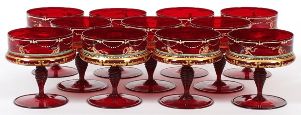 MURANO RED GLASS & ENAMEL COMPOTES C. 1930: MURANO RED GLASS & ENAMEL CHAMPAGNE/DESSERT COMPOTES, C. 1930, ELEVEN, H 4 1/2":Hand blown. A set of 11, each is enamel decorated with nude dancers with veils. For a high resolution photo
