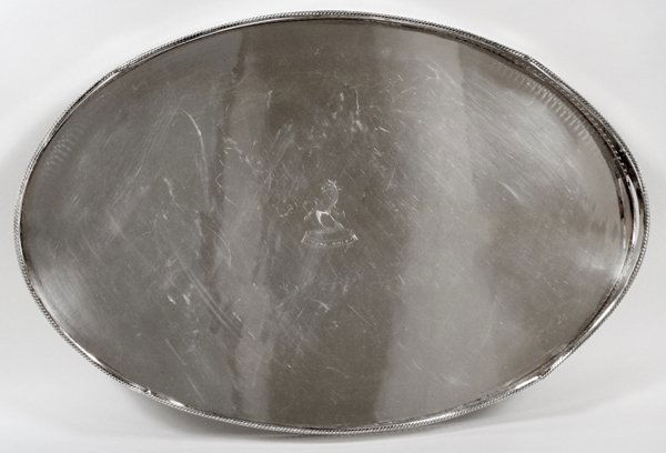 ENGLISH SILVERPLATE GALLERY TRAY: ENGLISH SILVERPLATE GALLERY TRAY, L 24":Oval electroplate silver gallery tray with pierced handles and border, engraved crest at the well, raised on four feet; unidentified mark underneath (see additi