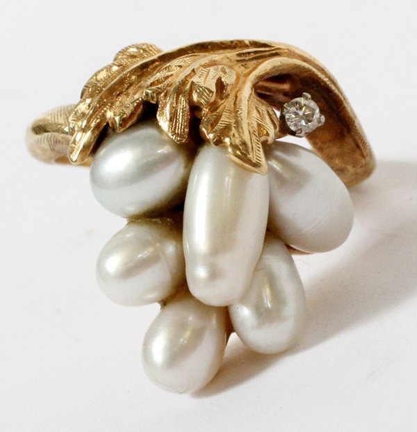 14KT YELLOW GOLD PEARL AND DIAMOND RING: 14KT YELLOW GOLD, PEARL, AND DIAMOND RING, SIZE 6 3/4:Having 6 pearls mounted to a 14kt yellow gold foliate style setting, enhanced by a single round cut diamond. Weighing approximately 7.7 grams. For