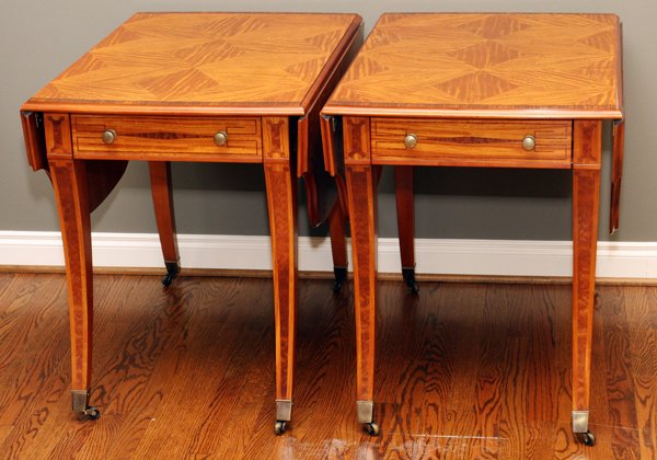 JOHN WIDDICOMB FRUITWOOD DROP LEAF PEMBROKE TABLES: JOHN WIDDICOMB FRUITWOOD DROP LEAF PEMBROKE TABLES, PAIR, H 28", W 49", D 34":Having satinwood with rosewood edging, saber legs and brass pulls and castors; each with a single drawer. With both leaves