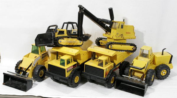 TONKA BULL DOZER, LOADERS, BACK HOE & TRACTOR: TONKA TRUCK, BULL DOZER, TWO FRONT END LOADERS, BACK HOE & TRACTOR, C1970, SIX:Yellow Tonka steel with rubber tires equipment vehicles. Two dump trucks L17" x W8" x H10". Two front end loaders, L19" x