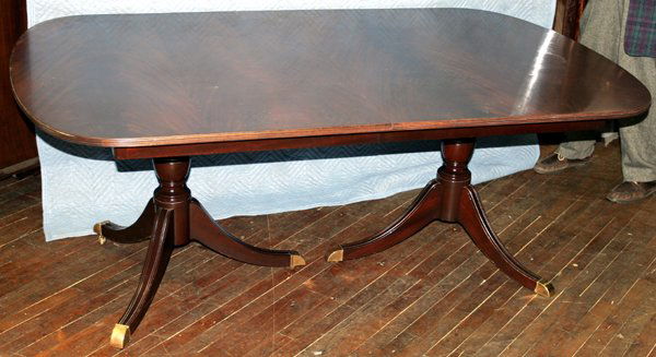 DUNCAN PHYFE MAHOGANY DINING TABLE, W46" L68": DUNCAN PHYFE MAHOGANY DINING TABLE, WITH 3 LEAVES, W 46", L 68":Three extra large leaves. Banquet style with leaves. Casters. Brass caps on legs.