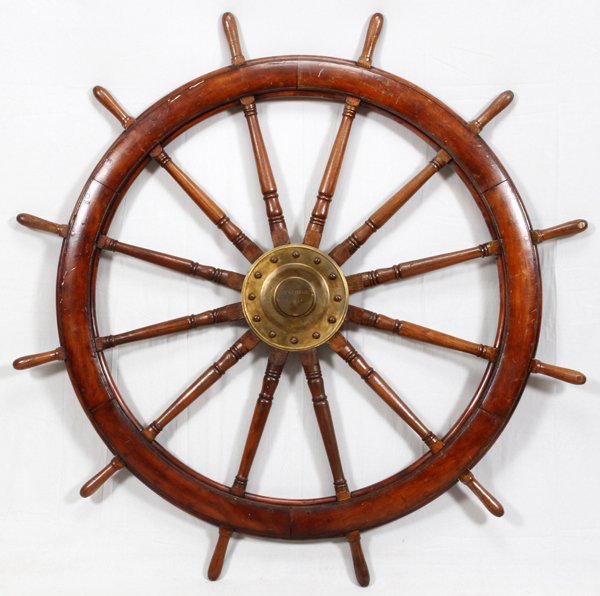 OAK AND BRASS SHIP WHEEL: OAK AND BRASS SHIP WHEEL, DIA 72", "BY GEORGE II":A wood ship wheel with central brass fitting a plaque marked "By George II".